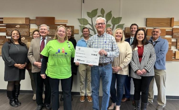 Submitted photo. Carolyn Dillard, board chairman for Richard’s Kids, and Pat Henry, treasurer, receive a $4,000 grant from the North Georgia Community Foundation at its headquarters in Gainesville on Dec 6.