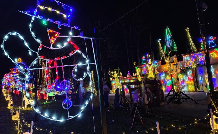 Megan Horn/The Clayton Tribune. Glowing characters and the sounds of holiday music greet visitors to the Christmas Village of Lights displayed at 90 Tiger Connector, Tiger.