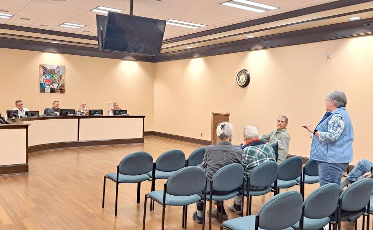 Megan Horn/The Clayton Tribune. Rabun County resident Julie Mayer speaks in favor of the school board opting out of HB 581 during the Jan. 20 public hearing held at the district office.