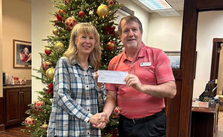 Submitted photo. Karen Bacon, Club Foundation Chair for Clayton Rotary, presents Chris DiNofrio, Treasurer for American Legion Post 220, with a check for $6,200 to support the American Legion Food Distribution Program.