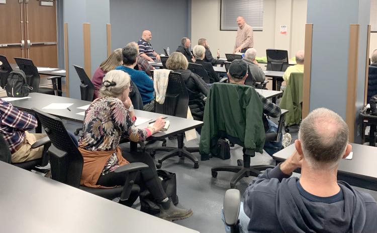 Submitted photo. A group of people listen to Rabun County EMS Capt. Trampes Stancil discuss health risks on Jan. 28 at the quarterly public health talk.
