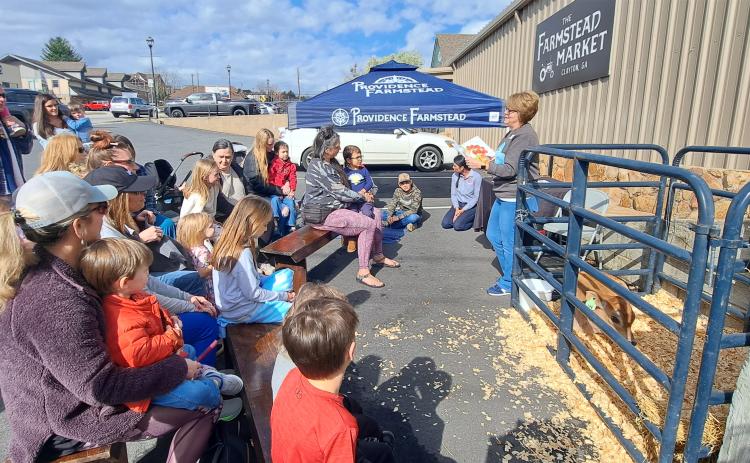 Megan Horn/The Clayton Tribune. Kim Cannon with Children’s Services at Rabun County Public Library reads “Miss MacDonald Had a Farm” by Kalee Gwarjanski during “On the Road Storytime.”