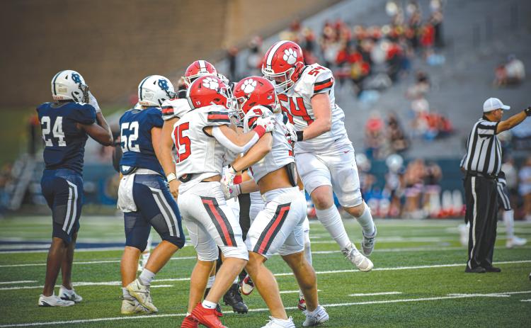 Wade Cheek/The Clayton Tribune. The Rabun County defense celebrates a turnover during its Week 1 win over White County in 2024.
