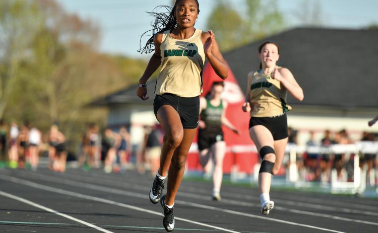 Wade Cheek/The Clayton Tribune. Kada Augustin (left) and Cassidy Klimasewski (right) finished second and eighth in the girls 100-meter dash, respectively, in last Thursday’s meet at Stephens County High School.