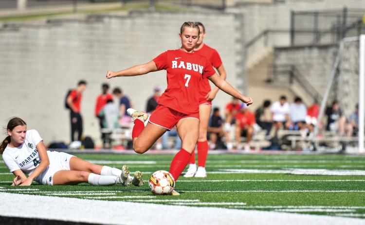 Wade Cheek/The Clayton Tribune. RCHS senior Kenzie Stout fires a pass during last Thursday’s region loss to Athens Academy. The Lady Cats finished region play with a 3-4 record.