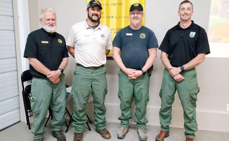 Pictured are Byron Haire, Lead Public Information Officer (PIO) for the Southern Area Gold Incident Management Team; Brent Saulsbury, Engine Boss and PIO for the Chattahoochee-Oconee National Forest; Jeffrey Schardt, district fire management officer for the United States Department of Agriculture (USDA) Forest Service; and Anthony English, Community Wildlife Defense Grant Coordinator for the Georgia Forestry Commission.