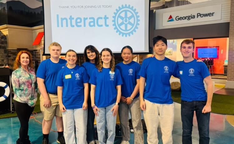 Photo courtesy of Tallulah Falls School. Clayton Rotary President Sheryl Webster, Tate Colston, Emma Ivester, history teacher Nancy Almoyan, Carsyn Griffis, Emily Cai, Danny An, and Timothy Beck participate in the annual Interact Conference in Cumming, Georgia.
