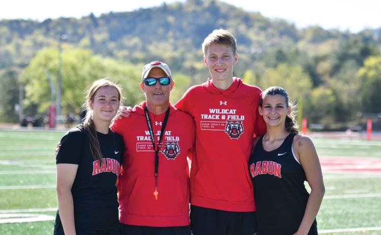 Wade Cheek/The Clayton Tribune. The RCHS track and field team held its senior night on Tuesday, April 15, honoring three seniors. Joined with head coach Tim Corbett are seniors (from left), Chloe Erlewine, G.B. Anderson and Arabella Kitchens. Not pictured are Clayton Blalock and Cameron Blalock.