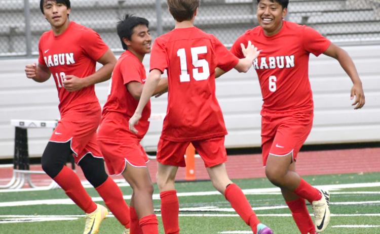 Enoch Autry/The Clayton Tribune. Rabun County junior Christian Avila (6) receives congratulations from his Wildcat teammates on April 25 after Avila scores his second goal of the game against Towers. RCHS won the playoff game 6-2 to advance to play Temple.