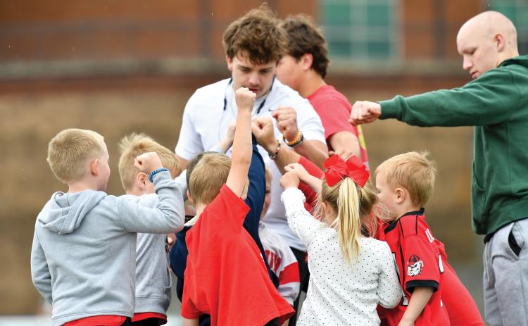 Wade Cheek/The Clayton Tribune. Rising senior running back Lake Evans breaks the huddle down with a group of campers at Rabun County football’s youth camp on Saturday, May 10. The Tri-State camp had former Wildcat standouts Charlie Woerner and Bailey Fisher in attendance for the youth.