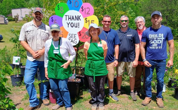 Megan Horn/The Clayton Tribune. Pictured are John Scaduto, Rabun County UGA Extension Coordinator; Nathan Eason, ANR agent/CEC for White County UGA Extension Office; Kathy Booker; Laura West; Steven Patrick, Habersham County UGA extension coordinator; Jonathan Twitty and Dalton Marks with Victory Home, who volunteered during the plant sale.