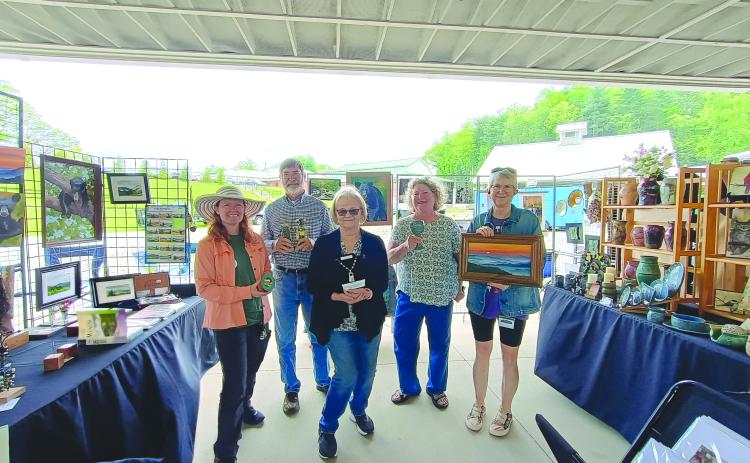 Megan Horn/The Clayton Tribune. Sassafras Artisan Market featured many creative artists from around the area. Macon County Art Association’s Uptown Gallery featured artists including Kathy Cooper with watercolor/painting; April McNiff with photography; Paul Pieringer with assemblage sculptures; Kay Wolf with pottery; and Kathleen Woodring with jewelry.