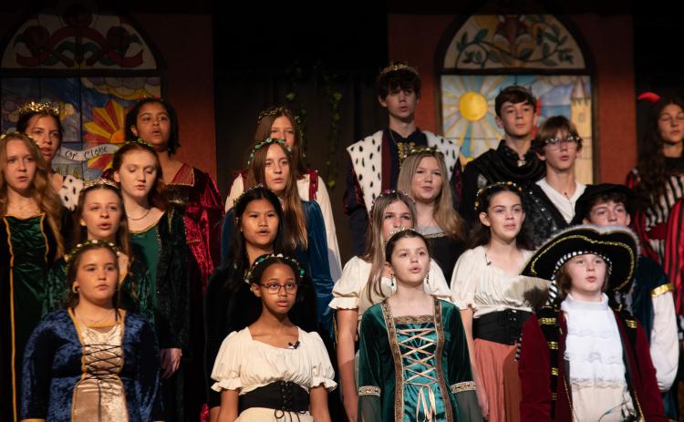 Photos courtesy TFS. TFS middle school students sing together as part of the 2025 Madrigal. Students bring acting, music, art, dance, and more to the yearly show.
