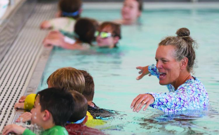 Landen Todd/The Northeast Georgian. Coach Amy Hood leads Tallulah Falls swim campers in a swimming exercise.