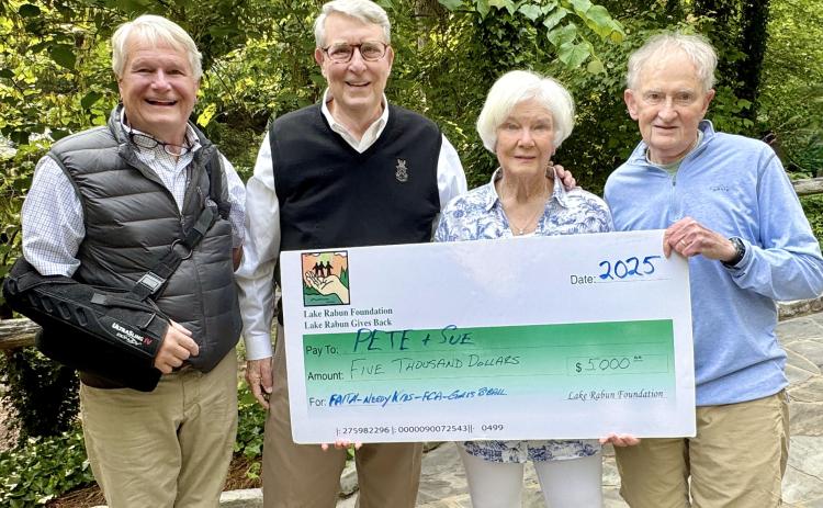 Photo courtesy of Richard Simms. Pictured are Buz Stone, who headed the LRA Foundation for 25 years and for whom the award is named, left; Pete Halter; Sue Halter; and Steve Raeber, executive director of the Lake Rabun Foundation. The Buz Stone Award was announced during the May 25 Lake Rabun Association (LRA) annual general membership meeting. Award recipients receive a $5,000 grant from the Lake Rabun Foundation to Rabun charities selected by the recipient.