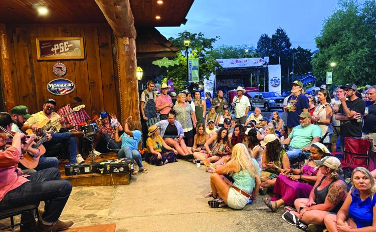 Photo courtesy Sonya Shook. Ramshackle’s headliner Town Mountain was unable to play on the main stage because of the June 7 rainstorm that got the area wet, but that did not keep the band from playing. “We were very thankful they played acoustic in front of Reeves Outdoor Center,” said Sonya Shook of Reeves and the CMBA president. “It was a cool experience for the fans that came and listened to them play.”