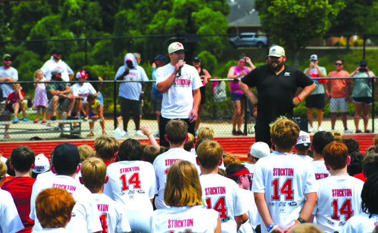 Enoch Autry/The Clayton Tribune. Georgia Bulldogs’ quarterback Gunner Stockton talks with youth at his Gunner Stockton Football Camp at Lakeview Academy in Gainesville, Ga., on July 20. The campers each received a Stockton T-shirt with his jersey number 14 on the back.