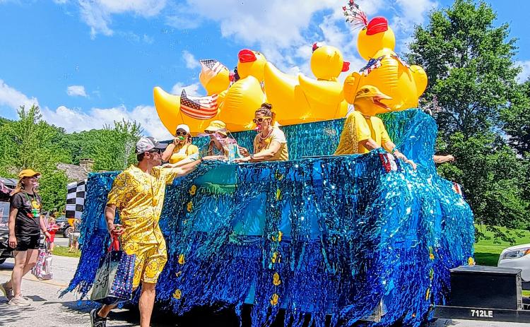 Megan Horn/The Clayton Tribune. This Sky Valley Grand Parade float on July 5 featured giant ducks on water with many decorated participants, marketing the annual Sky Valley Rubber Duck Race that had a lot of happy youth smiling. The float won First Place in the Grand Parade.