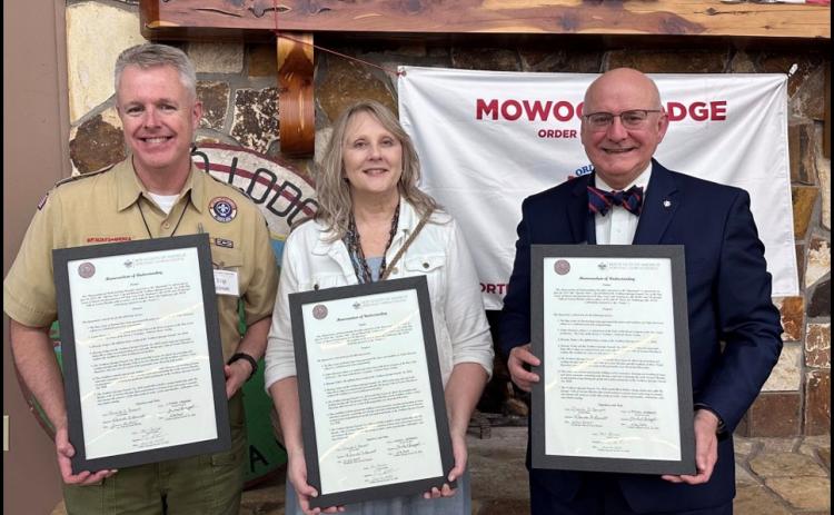 Submitted. The Georgia Tribe of Eastern Cherokee and the Executive Board of the Northeast Georgia Council, BSA, joined on June 26 to sign a Memorandum of Understanding that expressed these shared values and a commitment to support each other in increasing awareness and promoting authentic Cherokee heritage. Pictured are Trip Selman, Rhonda Bennett and Michael Levengood holding framed copies of the Memorandum of Understanding (MOU).