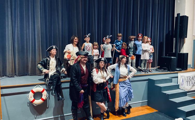 Submitted photo. Grownups (from left) Abbie Boggs, Julie Best, Peyton Wood, Sara Jones and Dannyale Williams of the North Georgia Community Players’ “Treasure Island” pose with youth who helped out as “crew” members.