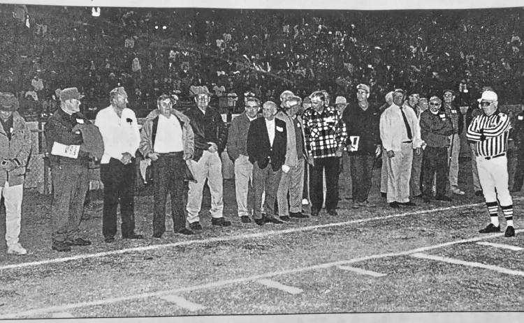 File photo/The Clayton Tribune. Members of the 1949 Rabun County football team served as honorary captains before the Oct. 23, 1998, Wildcat game on “Alumni Night.” The head coach of the first RCHS football team, Richard Burrell, passed away last at the age of 97. Burrell, a history teacher, also coached baseball and boys and girls basketball at RCHS.
