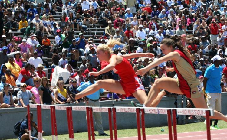 Submitted. Rabun County’s Sally Woerner (left) clears a hurdle during the state finals of 2014.