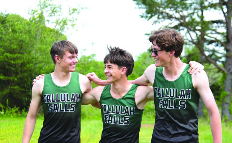 Photo courtesy of Elisha Boggs. Ryan Anderson, Oier Linera Mallea and Gavin Simmons support each other throughout the Tallulah Falls School year.