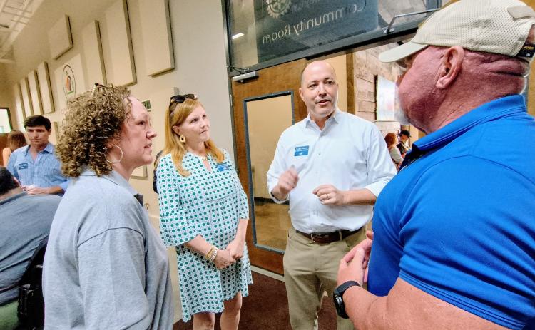 Megan Horn/The Clayton Tribune. Georgia gubernatorial Republican candidate Chris Carr, center, speaks with members of the community during a Friday, Aug. 15, Meet-and-Greet event. Pictured are Benita Cotton-Orr, left; Joan Carr (wife); Carr; and Rabun County Sheriff Mark Gerrells.