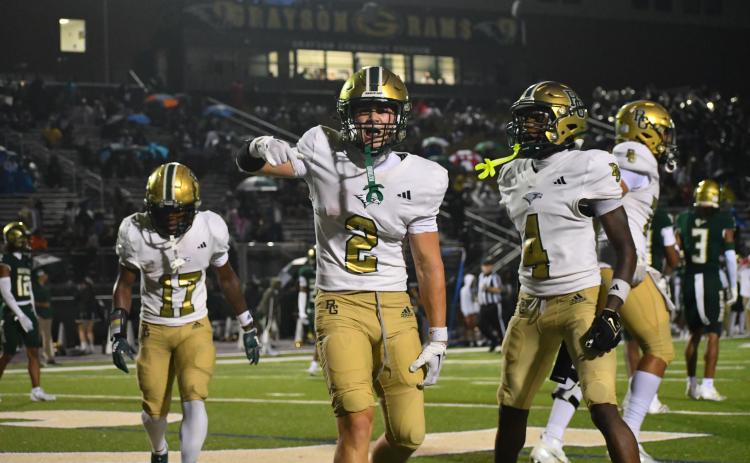 Wesley Branch/The Clayton Tribune. Rabun Gap senior and Indiana commit Walker Bryson celebrates in the end zone after a touchdown against Grayson in RGNS’s 24-19 loss to begin the season in a game with national football powerhouses.
