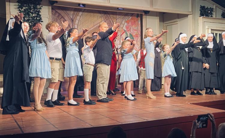 Photo courtesy Steven Webster. North Georgia Community Players actors take a stage bow after opening night of “The Sound of Music” last weekend. Pictured in the center are Anthony Schandel, who plays Captain Georg von Trapp, and Lucy Barry, who plays Maria. There are still two more weekends to see the show at the Dillard Theater, Aug. 15-17 and Aug. 22-24.
