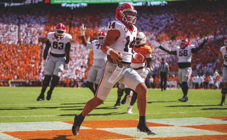 Tony Walsh/UGAAA. Georgia quarterback Gunner Stockton runs into the end zone during Georgia’s 44-41 overtime win over Tennessee at Neyland Stadium in Knoxville, Tenn., on Sept. 13. Stockton also threw two TD passes.