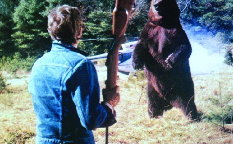 Submitted Photo. Andrew Prine battles the bear on the movie scene of “Grizzly” that was filmed in Clayton. The 1976 film will be shown at the Highlands-Cashiers Film Festival on Saturday, Sept. 20.