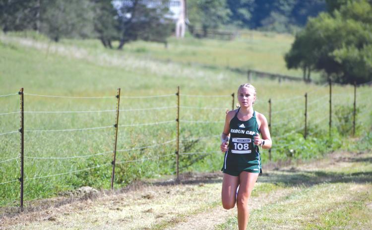 File Photo. Rabun Gap's Bailey Brackett set a new school record of 17:12.70, breaking her own previous record for the third time in her career.