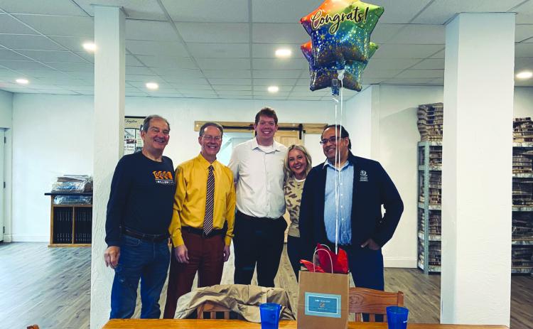 Katie Hamby/The Clayton Tribune. Steven Webster, 1 Mill Cups (from left); The Clayton Tribune Publisher Enoch Autry and Sports Editor Wesley Branch; and Kayla Flaherty and Bez Rengifo, 1MC, pose for photo as Tribune was honored. Not pictured, Tribune News Editor Megan Horn, Office Manager Katie Hamby and Senior Sales Associates Debbie Martin and Tony Penrose.