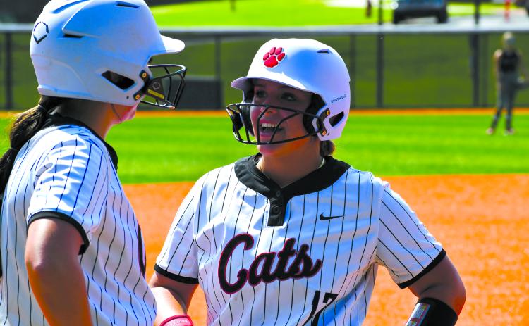 Wesley Branch/The Clayton Tribune. Rabun County Softball sophomore River Evans and senior Presley Burrell talk on third base during Rabun County’s 20-3 Aug. 16 win over Tallulah Falls. Both players earned all-region honors this season.
