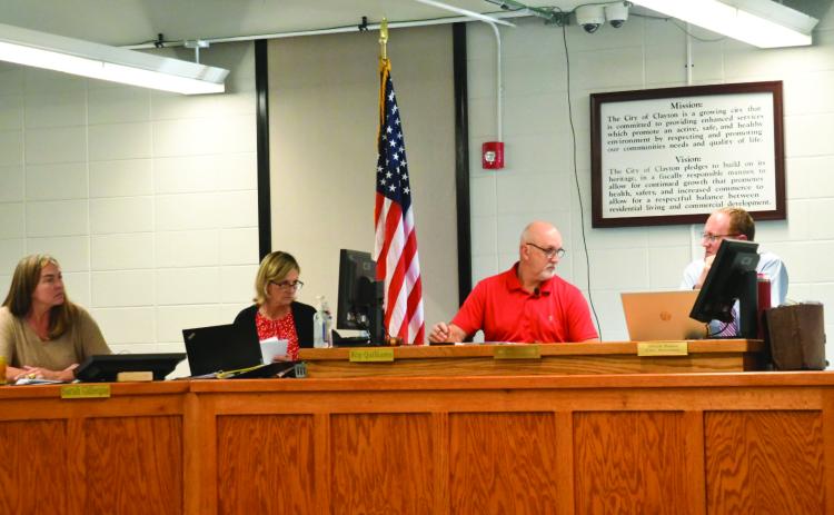 Enoch Autry/The Clayton Tribune. Clayton City Manager Trudy Crunkleton and Mayor Roy Quilliams look in the direction of City Attorney Mitch Baker during the Oct. 14 meeting at the Clayton City Hall. The Oct. 14 meeting was the first meeting with Quilliams as the city’s new mayor.