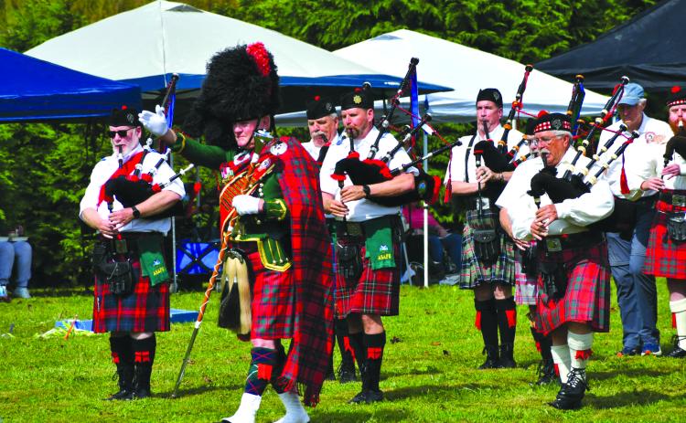 Enoch Autry/The Clayton Tribune. The Fraser Highlanders Pipe Band and with Col. Butch Teston performs Scottish music for the crowd at the Highlands Games on Sept. 27.