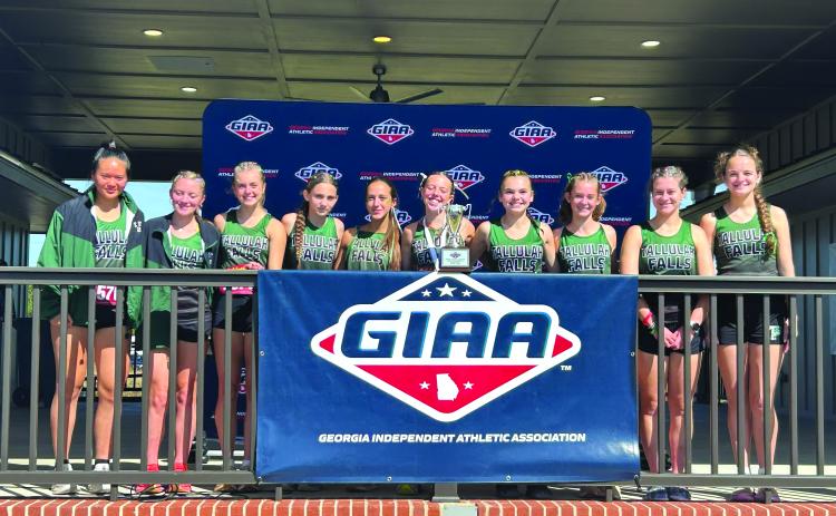 TFS Athletics/The Tallulah Falls girls cross country team shows their state runner-up trophy they claimed in Macon.