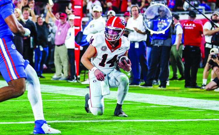 Conor Dillon/UGAAA. Current Georgia and former Rabun County quarterback Gunner Stockton takes a knee at the 1-yard line to clinch a 24-20 victory for the Bulldogs over their arch rival Florida Gators on Nov. 1. Georgia has beaten Florida five consecutive years, including this season.
