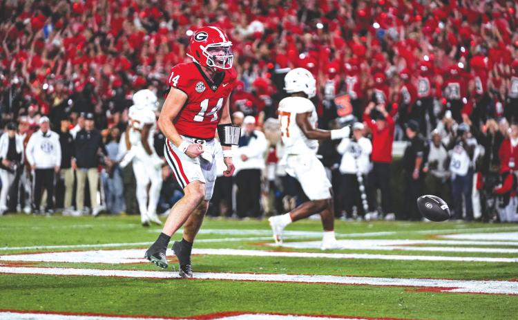 Tony Walsh/UGAAA. Former Rabun County and current Georgia quarterback Gunner Stockton celebrates in the end zone after a rushing touchdown in the Dawgs’ 35-10 win over Texas. Stockton accounted for all five of UGA’s scores.