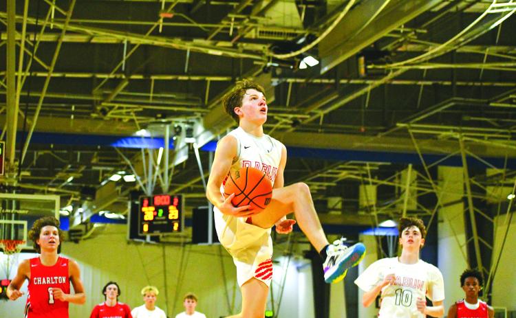 File Photo/The Clayton Tribune. Rabun County’s senior guard Huey Blalock goes in for a bucket. The RCHS boys are a state preseason No. 3.