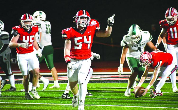 Enoch Autry/The Clayton Tribune.  Rabun County will host Dodge County in the first round of the state playoffs on Friday, Nov. 14, at Frank Snyder Memorial Stadium. Here junior defensive lineman Ryan Yearwood (54) celebrates after the Wildcats make a stop against Athens Academy at home on Oct. 24.