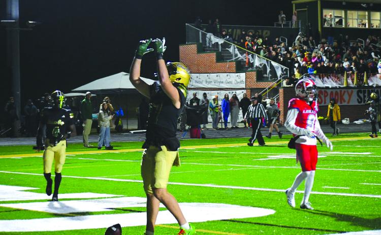 Enoch Autry/The Clayton Tribune. Rabun Gap sophomore tight end Cash Washburn points to the sky after catching a touchdown pass against visiting Legacy Sports Agency.