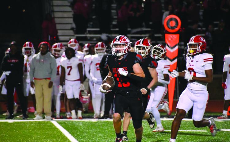 Wesley Branch/The Clayton Tribune. Rabun County senior Reid Giles returns an interception against Dodge County on Nov. 14 in the Wildcats’ 56-21 playoff win over the Indians. Rabun County hosts Berrien on Nov. 21 for the second round of the Class A Division I playoffs.
