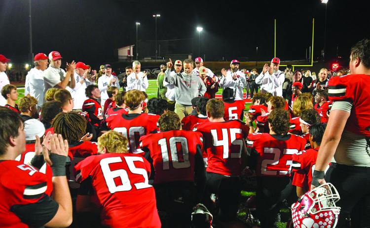 Enoch Autry/The Clayton Tribune. Coaches, support staff and Wildcat players applaud Rabun County head coach Rance Gillespie’s approval that RCHS is one of eight teams remaining in the Class A Division I playoffs. Gillespie said the team has embraced being “EL1TE” and now the Wildcats have reached the Elite Eight and will play after Thanksgiving.