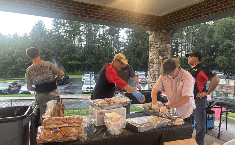 Submitted photo. Carpe Diem Rotary Impact Club members were often seen serving food in the band concession stands at the Rabun County Wildcats football games this season.