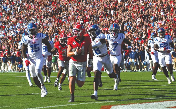 Wesley Branch/The Clayton Tribune. Former Rabun County and current UGA quarterback Gunner Stockton strolls into the end zone for a rushing touchdown in Georgia’s 43-35 win over Ole Miss on Oct. 18. Last week, it was announced Stockton finished seventh in the 2025 Heisman Trophy voting.