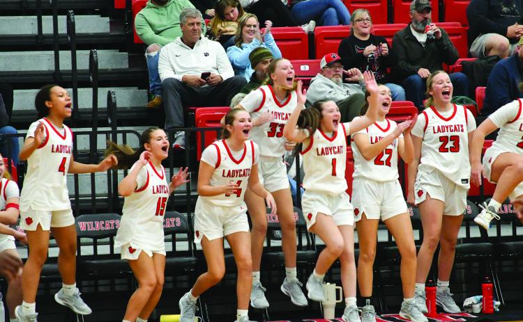 Enoch Autry/The Clayton Tribune. Rabun County Lady Cats celebrate when teammate senior Chloe Shirley scores in the fourth quarter of the girls’ win over East Hall on Dec. 5 at home.