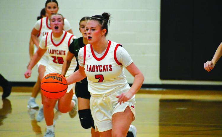 Wesley Branch/The Clayton Tribune. Rabun County junior guard Adelyn Thompson dribbles down the court in the Lady Cats’  53-45 win over North Hall on Nov. 25. Thompson scored 10 points and added two assists in the victory over the Trojans.