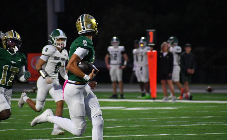Wesley Branch/The Clayton Tribune. Rabun Gap quarterback Gavin Owens runs into the end zone for a rushing touchdown in Rabun Gap's 42-0 win over Christ School on Oct. 17. Owens officially signed with Memphis University last Wednesday, Dec. 3.